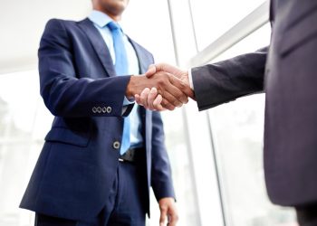 Handshake of two business people in the office